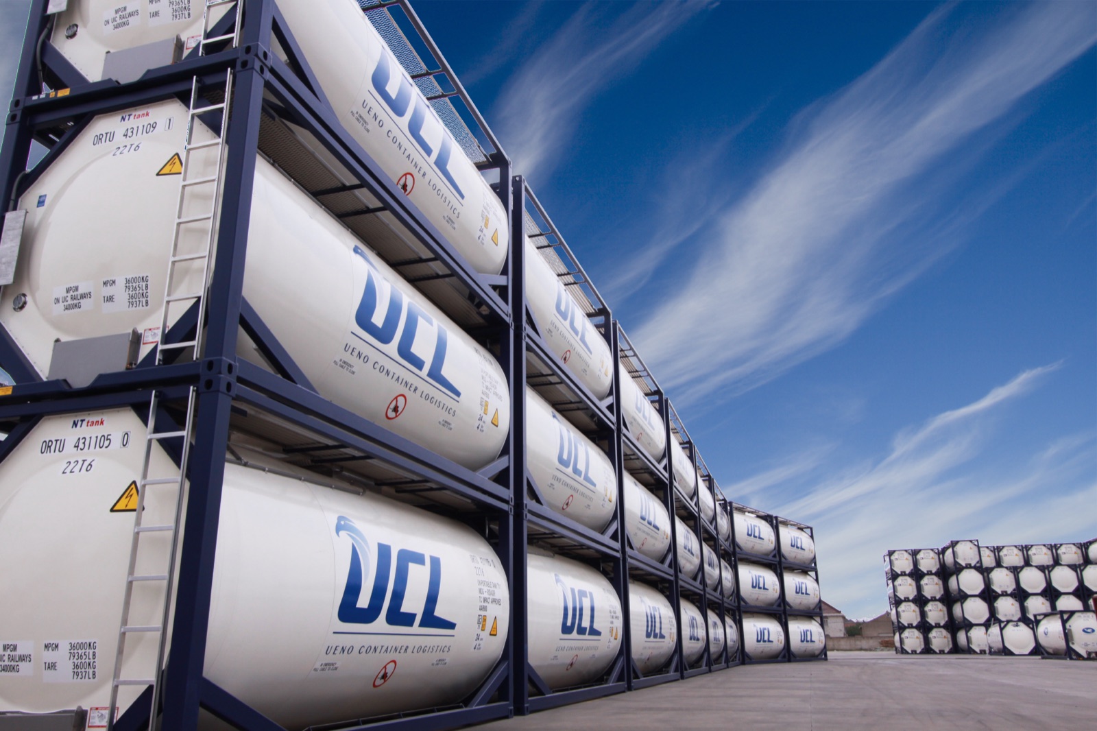 UCL Stacking Yard and ISO Tanks Against Blue Sky